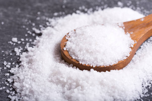 istock sea salt in a wooden spoon 647133852