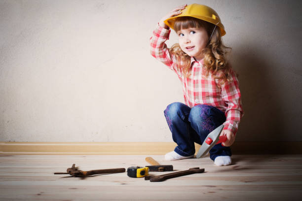 istock little girl plays in the builder 647137618