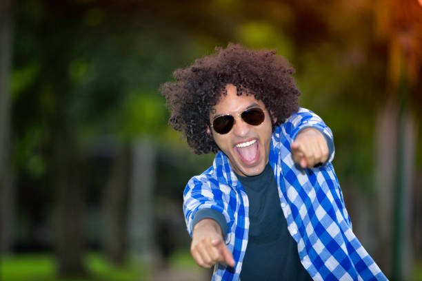 istock Young man with afro hairstyle and positive attitude 647140224