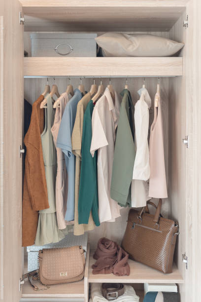 istock colorful clothes hanging on rail 647140520