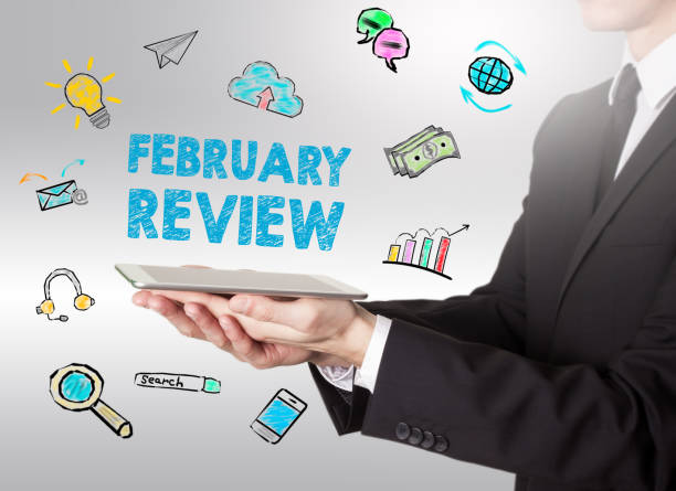 istock February Review concept, young man holding a tablet computer 647141750