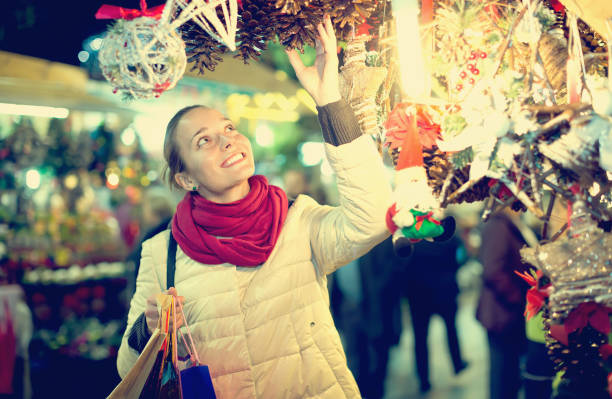 istock Woman at Christmas fair in evening 647142012