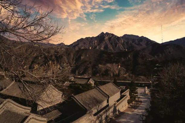 Beautiful landscape of ancient village house with view of Great Wall of China on the hill