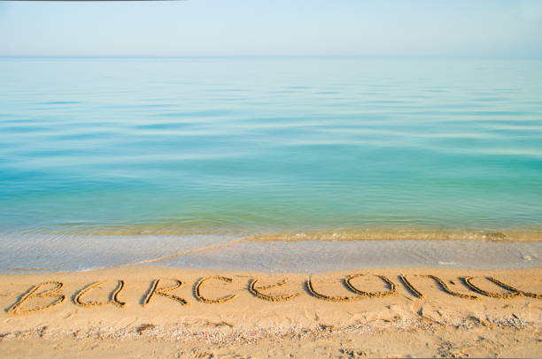 The inscription Barcelona on sand.