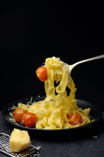 istock Traditional Fettuccine pasta with tomatoes cherry. 647150438