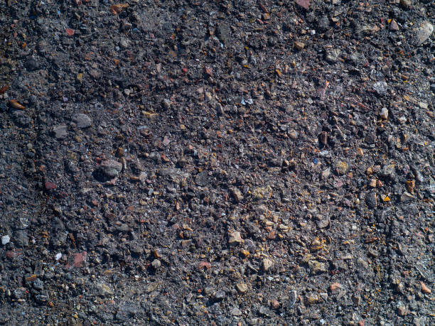 istock Texture of old asphalt with stones 647163836