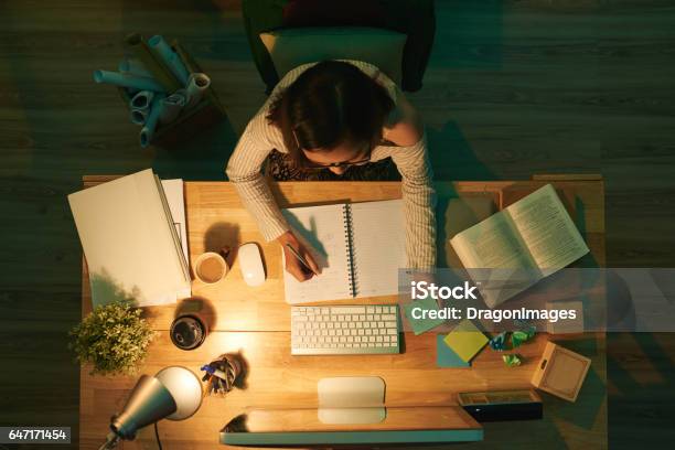 Studying At Night Stock Photo - Download Image Now - Studying, Learning, Examining