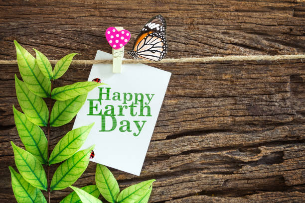 white with Happy Earth Day paper note hanging
