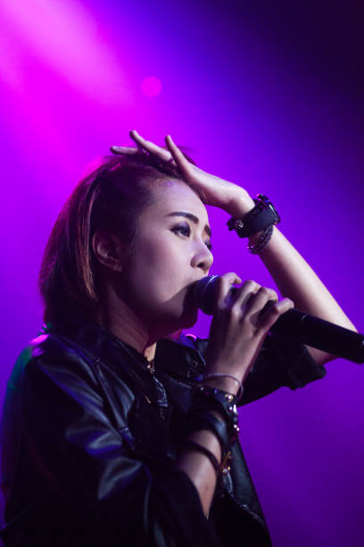 istock Thai singer in purple lights 647179692