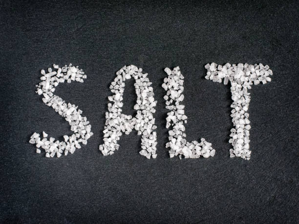 istock Salt word from coarse sea salt on stone 647183674