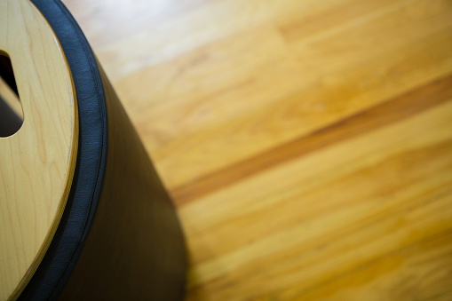 Close-up of gym equipment on wooden floor
