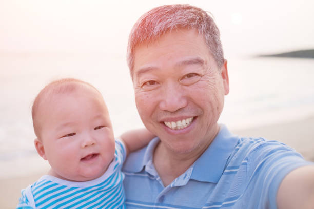 istock old man selfie with grandson 647186710