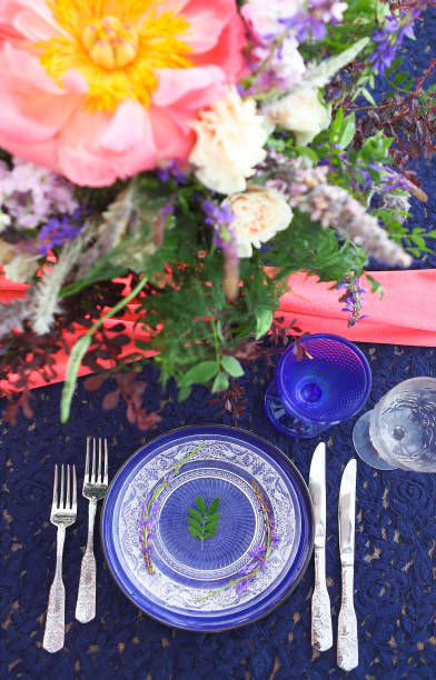 istock Table setting in vintage style is decorated with flowers 647187960