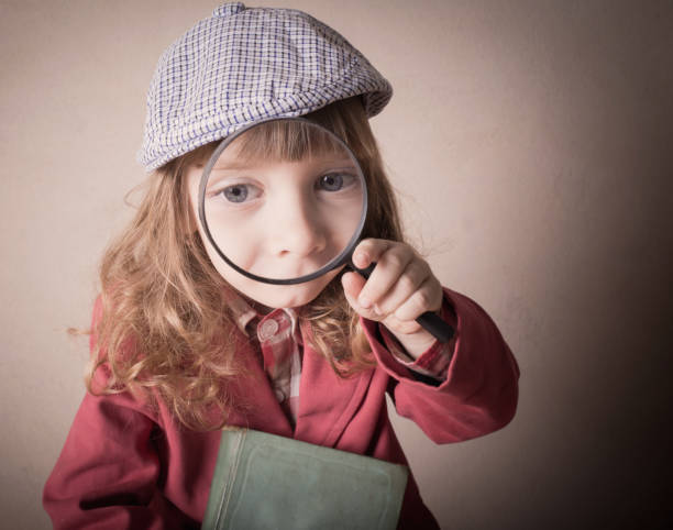 little girl with magnifying glass