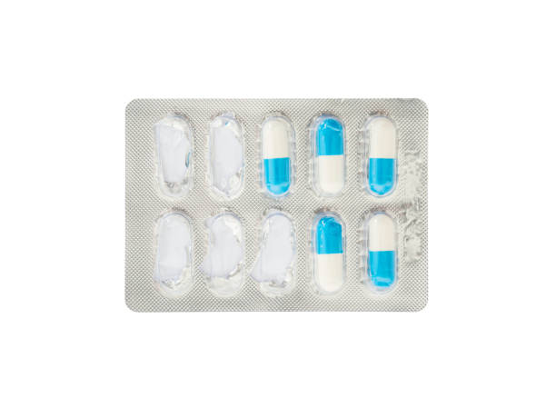 istock Closeup blue and white pills in blister pack isolated on white background with clipping path 647191944