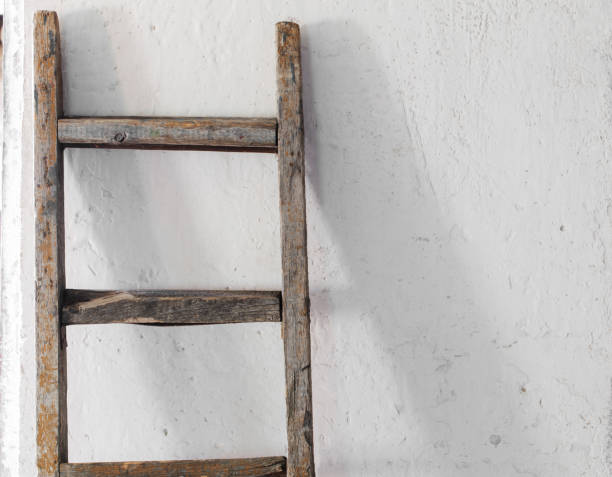istock old wooden stairs on white wall 647195698