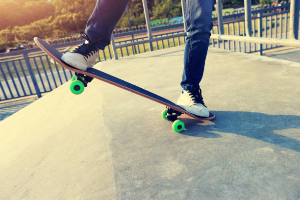 istock young skateboarder legs riding skateboard at skatepark 647196178