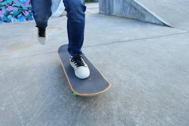 istock people legs practice skateboarding at skatepark 647196180