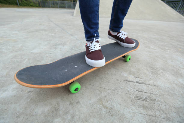 istock young skateboarder legs riding skateboard at skatepark 647196214