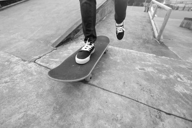 istock young skateboarder legs riding skateboard at skatepark 647196242