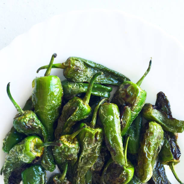 istock Fried Green Padron Peppers in white background 647206840