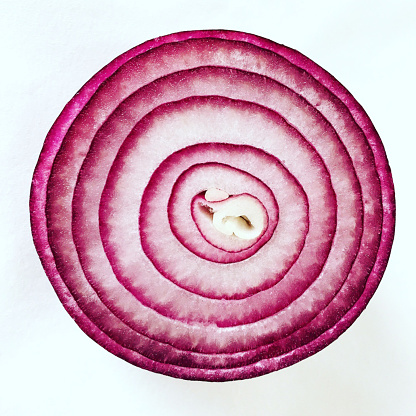 Red Onion Half cut isolated on white background. Mediterranean or healthy diet concept.