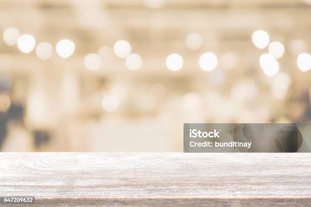 Wood Table Top And Blurred Restaurant Interior Background With Vintage Filter Stock Photo - Download Image Now