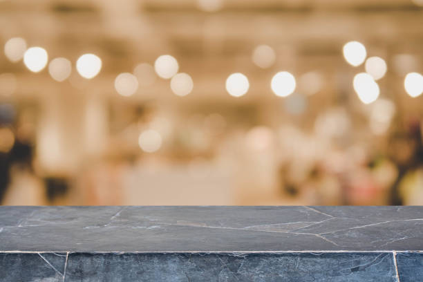 istock Stone table top and blurred restaurant interior background with vintage filter. 647209642