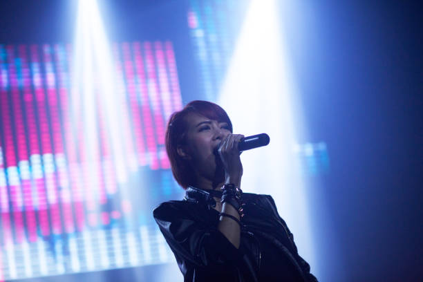 istock Thai rock singer in light beams 647211058