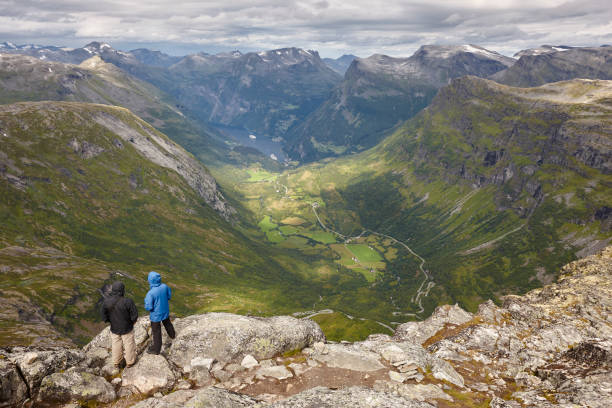 istock Norwegian rocky mountain landscape with hikers. Norway highlight. 647211354