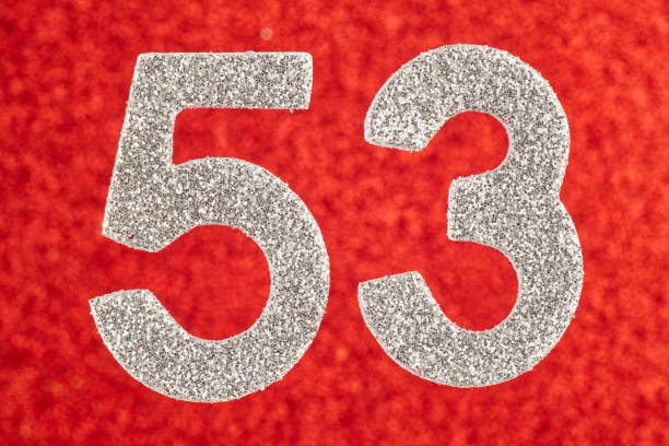 istock Number fifty-three silver color over a red background. Anniversary. 647212210