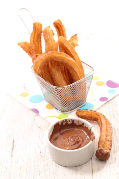 istock churros with chocolate sauce 647214766