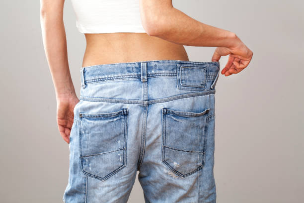 istock Weight loss woman with bluejeans 647214896