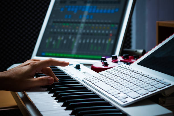 istock male hands working on sound studio equipments 647221356