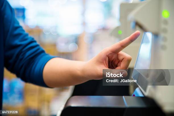 Close Up Of A Woman Using A Self Checkout Machine Stock Photo - Download Image Now - Self Checkout, Supermarket, Automated
