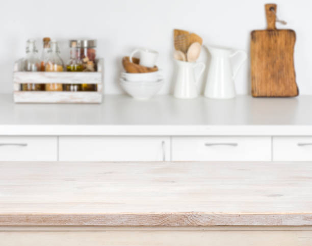 istock Light wood table with bokeh image of kitchen counter interior 647231578