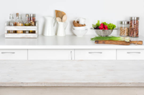 istock Wooden table on blurred kitchen interior background with fresh vegetables 647234646
