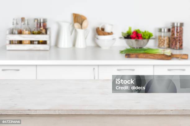 Wooden Table On Blurred Kitchen Interior Background With Fresh Vegetables Stock Photo - Download Image Now