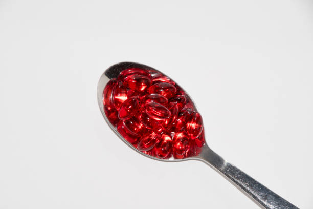 istock Tabs Vitamins, omega 3, Medications tablets and capsules in a beaker. Medications tablets, suppository bottles, capsules and thermometer on wooden table 647235216