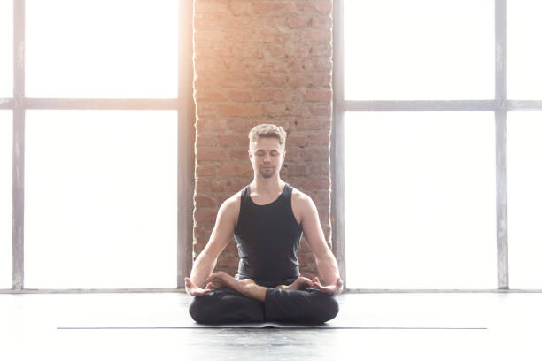 istock Portrait of a handsome man practicing meditation and yoga 647235232