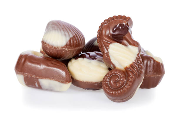 istock Belgian bonbons shaped as seashells isolated on white background 647235436