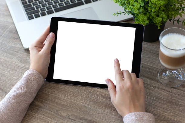 istock woman hands holding tablet PC computer with isolated screen 647243116