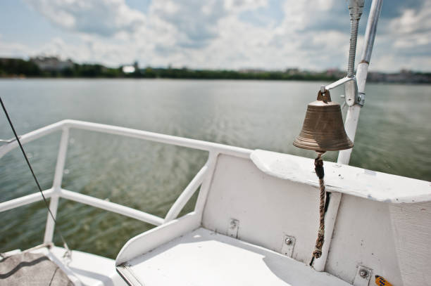 Iron bell on a small yacht at lake.