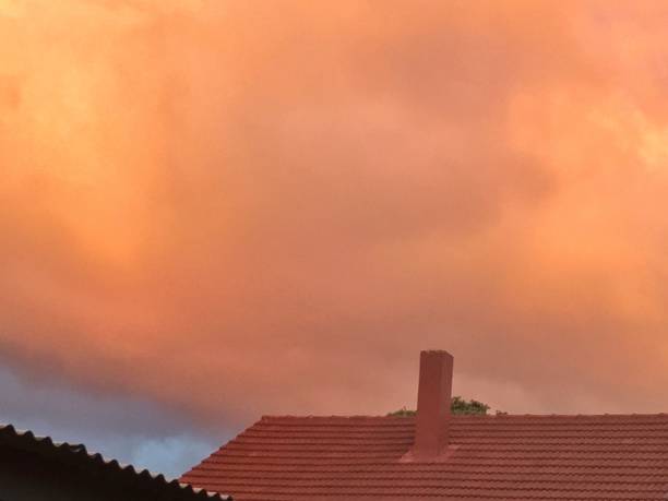 istock chimney roof orange cloud 647251730