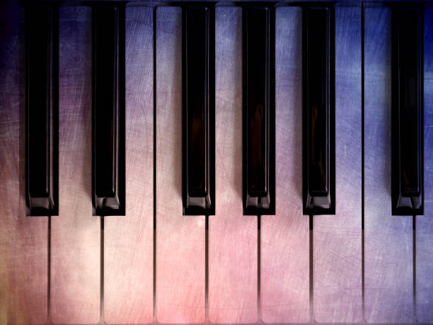 istock old piano keys with color scratch. music background 647252388