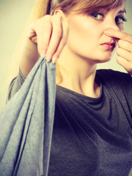 istock Disgusted woman holds dirty rag. 647255378