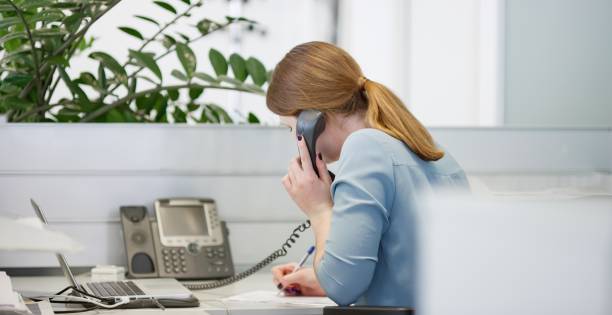 istock Young woman working in office 647259584