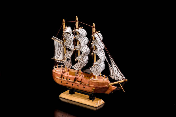istock Model of wooden ship, isolated on black 647267446