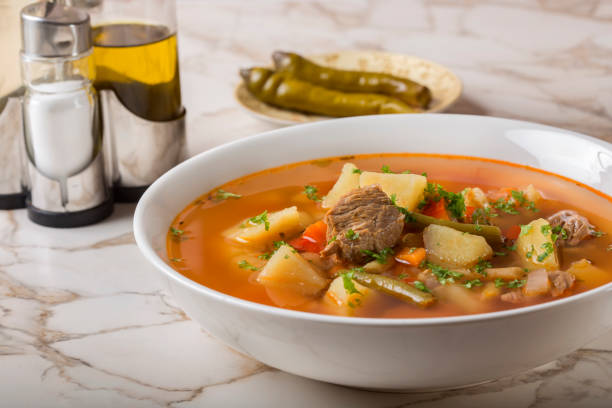 istock Bowl of vegetable beef soup and hot chilli peppers 647269870