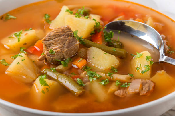 istock Bowl of vegetable beef soup with spoon 647270004